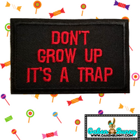 3.05"x2" DON'T GROW UP IT'S A TRAP Red Stitching on Black Twill Embroidered Patch with Choice of Backing